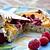 recette Tartelettes aux framboises et aux pêches sur simili frangipane