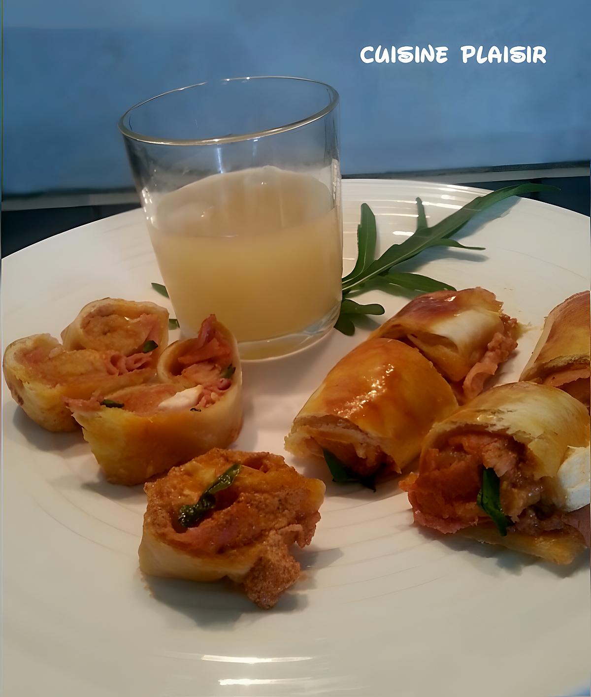 recette Amuses bouche .. au jambon, tomate, pesto, fromage.  en forme de palmiers/roulades