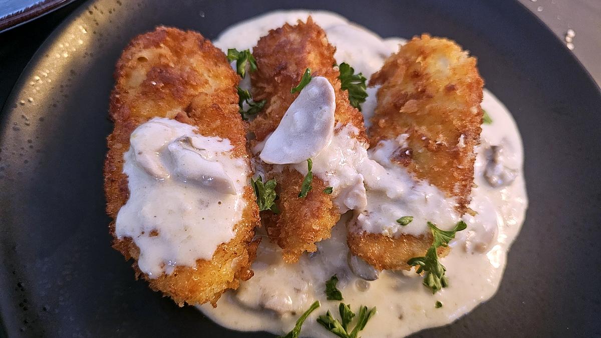 recette Escalope de dinde dorée et croustillante, sauce aux champignons et parmesan