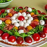 recette Tarte salée aux tomates cerises, mozzarella et roquette